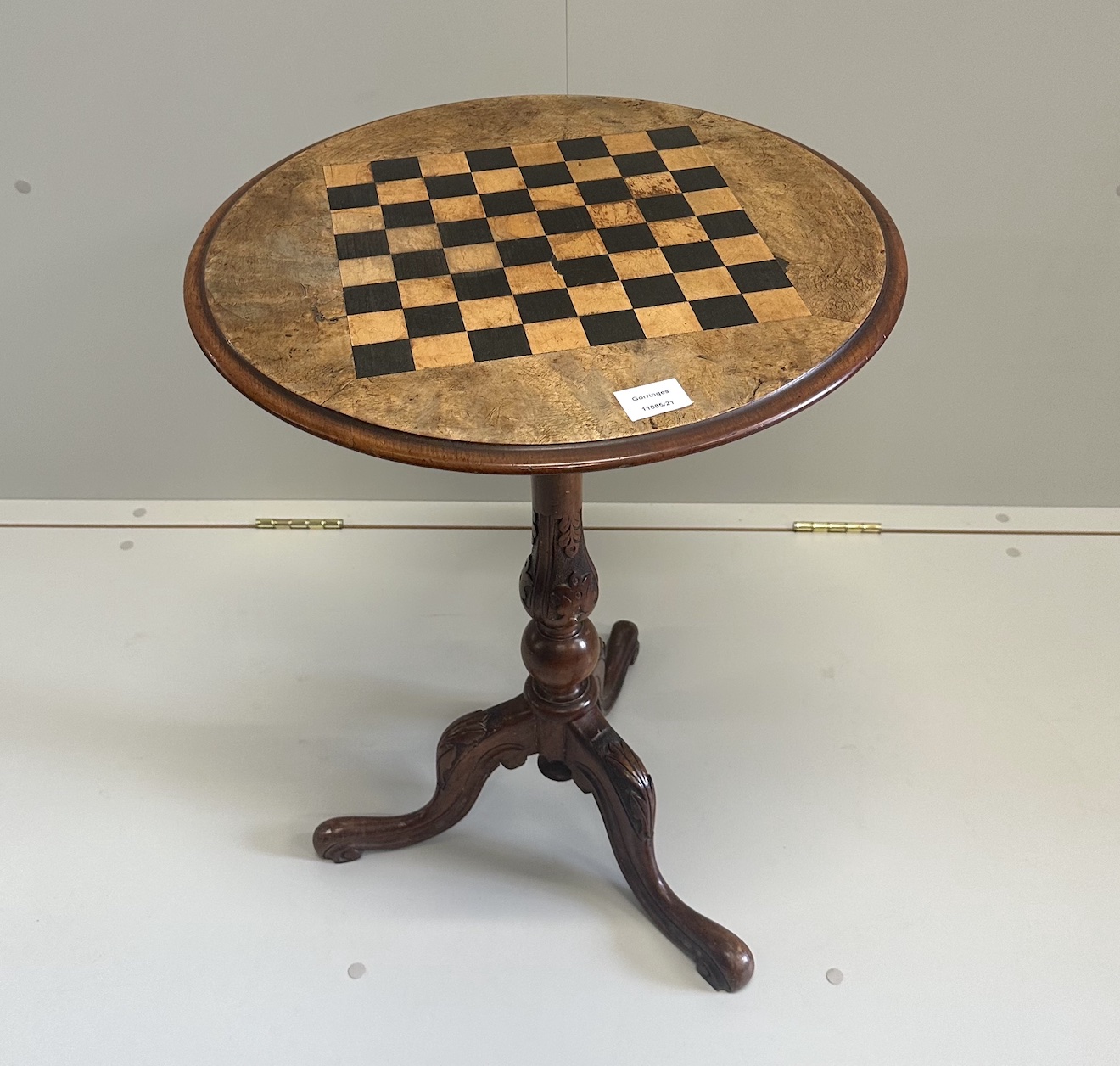 A Victorian circular walnut parquetry inlaid tripod games table, diameter 50cm, height 66cm